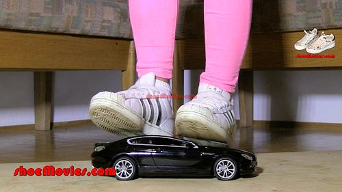 Jane crushes model car with her Buffalo boots (0055n-JaneOnModelCar2)