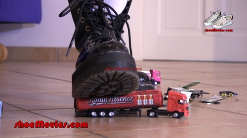Girl in patent boots crushes model cars 1-D (0142)