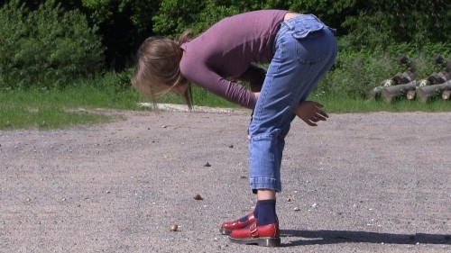 Girl in red Doc Martens girls shoes walks over snails 1-B (0115)